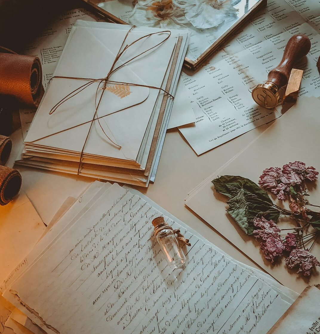 Writer's desk with papers, pen and coffee cup