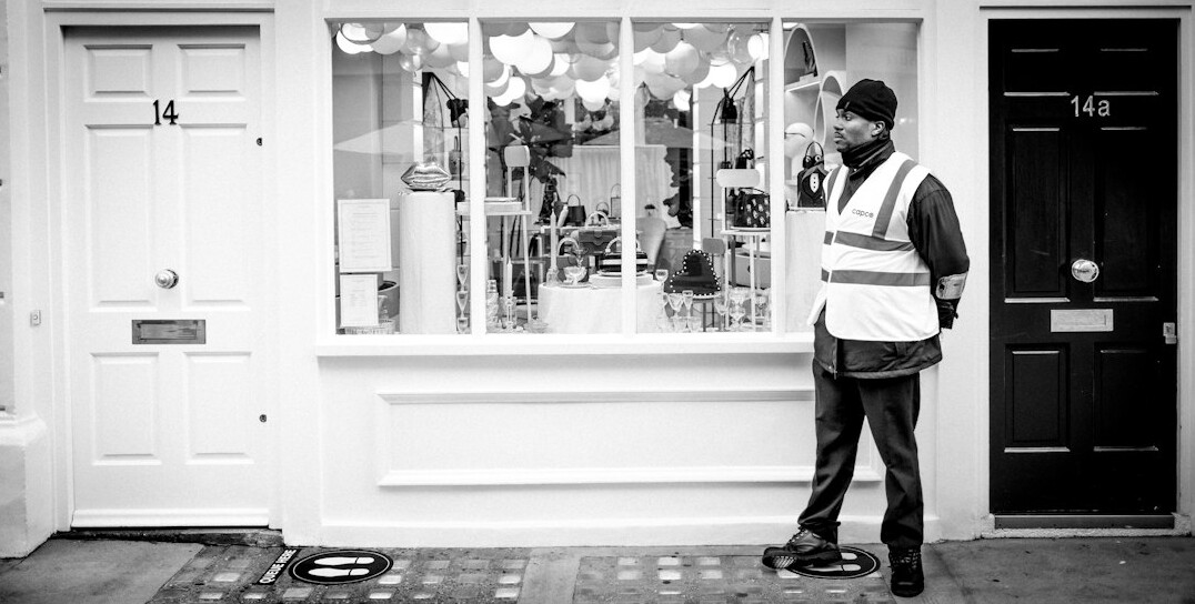 store security guard watching customers